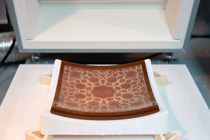 Brown and marzipan flower mandala platter in slumping mold.