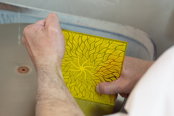 Yellow and yellow transparent glass sunswimmer being ground.