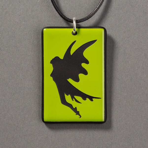 Sandcarved lime green and black glass fairy pendant.