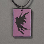 Sandcarved purple and black glass fairy pendant.