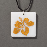 Sandcarved gold and white glass hibiscus flower pendant.