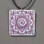 Sandcarved purple and white glass mehndi mandala pendant.