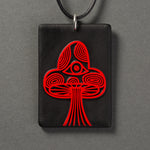 Sandcarved red and black glass mushroom pendant.