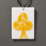 Sandcarved yellow and white glass mushroom pendant.