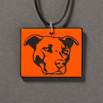 Sandcarved bright orange and black glass pit bull pendant.