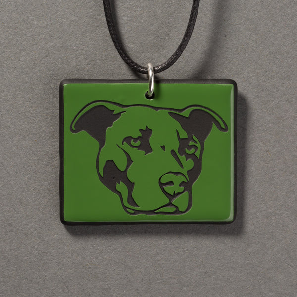 Sandcarved green and black glass pit bull pendant.