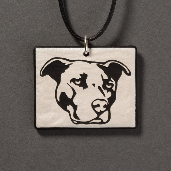 Sandcarved silver pearl and black glass pit bull pendant.