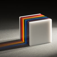 Rainbow and white glass cube.