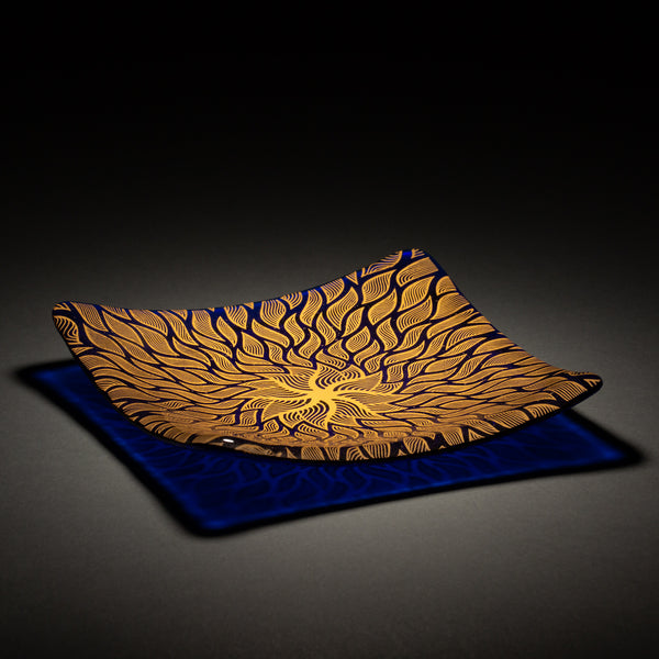 Sandcarved gold and caribbean blue glass sun swimmer plate.