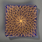 Sandcarved gold and caribbean blue glass sun swimmer plate.