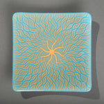 Sandcarved gold and cyan glass sun swimmer plate.