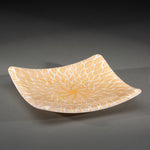Sandcarved gold and white glass sun swimmer plate.