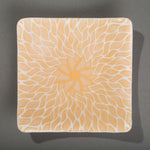 Sandcarved gold and white glass sun swimmer plate.