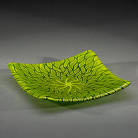 Sandcarved lime green and green transparent glass sun swimmer plate.