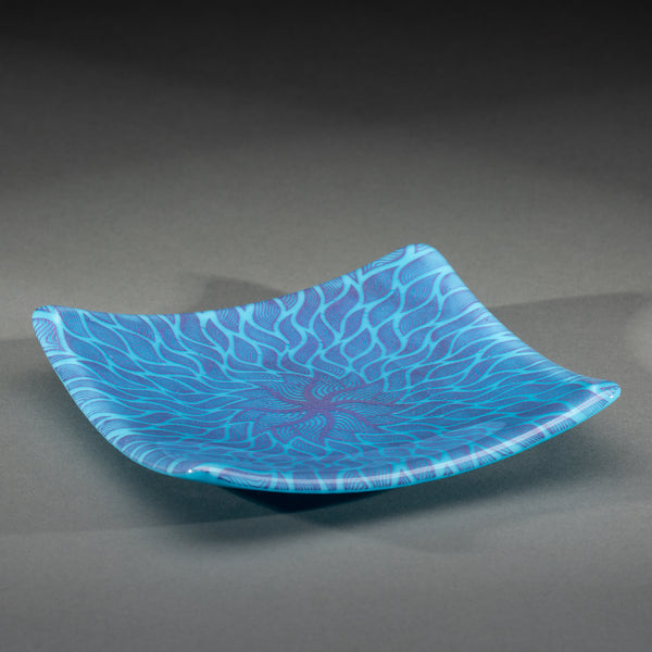 Sandcarved purple and cyan glass sun swimmer plate.
