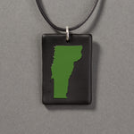 Sandcarved green and black glass vermont pendant.