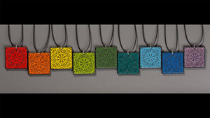 Sandcarved glass flower mandala pendants