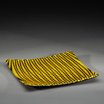 Sandcarved yellow and black glass circle party plate.
