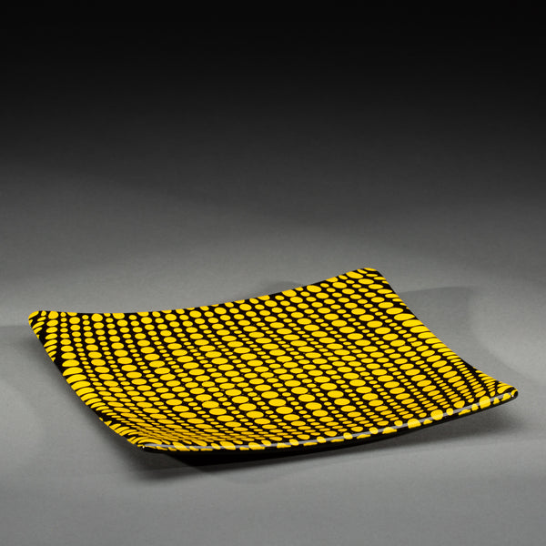 Sandcarved yellow and black glass circle party plate.