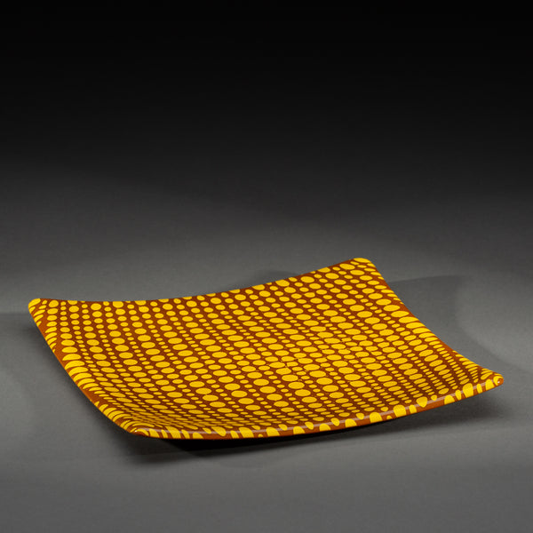 Sandcarved yellow and brown glass circle party plate.
