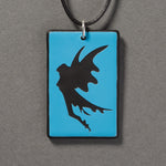 Sandcarved deep sky blue and black glass fairy pendant.