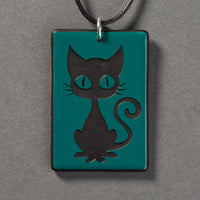 Sandcarved aquamarine and black glass kitty pendant.