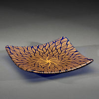 Sandcarved gold and caribbean blue glass sun swimmer plate.