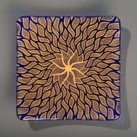 Sandcarved gold and caribbean blue glass sun swimmer plate.