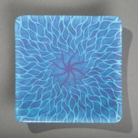 Sandcarved purple and cyan glass sun swimmer plate.