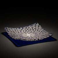 Sandcarved silver pearl and caribbean blue glass sun swimmer plate.