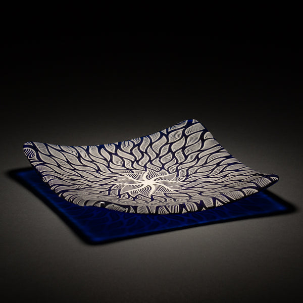 Sandcarved silver pearl and caribbean blue glass sun swimmer plate.