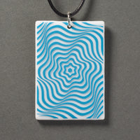 Sandcarved deep sky blue and white glass vortex pendant.
